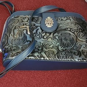 M.C. Marc Chantel Domed, tooled leather crossbody purse